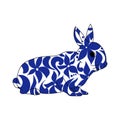 Outline illustration of a rabbit with floral patterns in blue, symbol of the year according to the eastern horoscope, vector Royalty Free Stock Photo