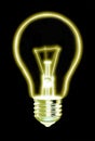 Outline of glowing yellow Light bulb, on black background Royalty Free Stock Photo