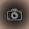 Outline photo camera icon on black/dark gray and beige gradient background Royalty Free Stock Photo