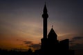 Outline of Shahada memorial mosque in Poklonnaya hill with bright sunset sky on background.