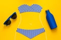 Outlines of girl in paper swimsuit drawing by chalk. Beach accessories. Top view. Flat lay. Summer travel and sun protection conce Royalty Free Stock Photo