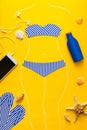 Outlines of girl in paper swimsuit drawing by chalk. Beach accessories. Top view. Flat lay. Summer travel and sun protection conce Royalty Free Stock Photo