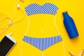 Outlines of girl in paper swimsuit painted by chalk. Beach accessories. Top view. Flat lay. Summer travel, sun protection concept Royalty Free Stock Photo