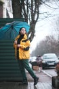 Outoor picture of young woman with umbrella