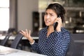 Outraged Indian female employee talking by phone Royalty Free Stock Photo