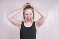 Outraged young woman having a temper tantrum shouting and screaming Royalty Free Stock Photo