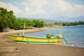 Outrigger boat ot the beach in Lovina, Bali Royalty Free Stock Photo