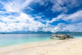 2 outrigger boats on a beautiful white sand beach Royalty Free Stock Photo