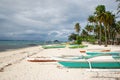 Outrigger boats on tropical beach Royalty Free Stock Photo