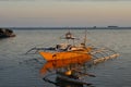 outrigger canoe at sunset