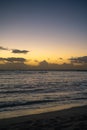 Outrigger Canoe Silhouetted at Sunrise on the Pacific Ocean in Hawaii Royalty Free Stock Photo