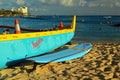 An outrigger canoe and a surf board, Royalty Free Stock Photo