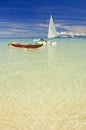 Outrigger canoes on sandy beach Royalty Free Stock Photo