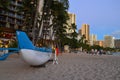 An outrigger is docked on the sands of Waikiki Royalty Free Stock Photo