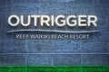 Outrigger Reef Waikiki Beach Resort entrance sign for Pacific luxury hotel chain headquartered in Hawaii. Royalty Free Stock Photo