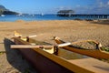 An outrigger rests on a tranquil beach Royalty Free Stock Photo