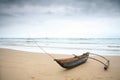 Outrigger under a stormy sky