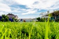 Outside of beautiful house and its garden with green lawn grass, pool and solar panels on the roof Royalty Free Stock Photo