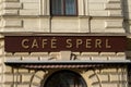 outside the coffee shop, a traditional Viennese coffee shop. evening time