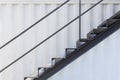 Outside metal staircase or fire exit stair with sheet corrugated wall background Royalty Free Stock Photo