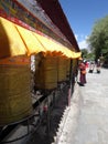 Outside potala palace lhasa city tibet praying wheels Royalty Free Stock Photo