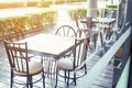 Outside shop in sunny day with tables and chairs of cafe , restaurant in the morning time which nobody uses them  .Outdoor of Royalty Free Stock Photo