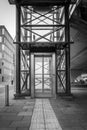 Outside steel and glass elevator in black and white