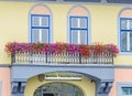 Outside vibrant colored windows with colored flowers balcony, ye