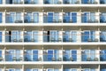 Outside view of balcony cabins with chairs and glass on large cruise ship Royalty Free Stock Photo