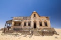 Outside view of one of the abandoned houses in the ghost town of Kolmanskop near LÃÂ¼deritz in Namibia Royalty Free Stock Photo