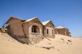 Outside view of one of the abandoned houses in the ghost town of Kolmanskop near LÃÂ¼deritz in Namibia Royalty Free Stock Photo