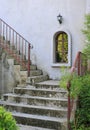 Outside vintage stair with metal railing. Construction is grunge and rusty touching Royalty Free Stock Photo