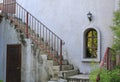 Outside vintage stair with metal railing. Construction is grunge and rusty touching Royalty Free Stock Photo