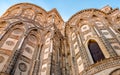 The outsides of the principal doorways and their pointed arches of the ancient Cathedral Church in Monreale, Sicily Royalty Free Stock Photo