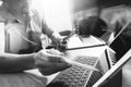 Outsource Developer working on marble Desk Working Laptop Computer Mobile Application Software and digital tablet dock smart