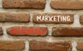 Outsourced marketing symbol. Concept words Outsourced marketing on beautiful brown brick wall. Beautiful brown brick wall