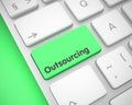 Outsourcing - Text on the Green Keyboard Keypad. 3D. Royalty Free Stock Photo