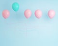 Outstanding blue pastel balloon in air one different idea from balloon pink the others on light blue background,Minimal concept i Royalty Free Stock Photo