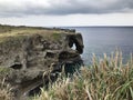 The outstanding cliff and a dazzling view of emerald ocean at Cape Manzamo in Japan. Royalty Free Stock Photo