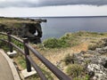 The outstanding cliff and a dazzling view of emerald ocean at Cape Manzamo in Japan. Royalty Free Stock Photo