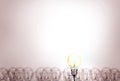 Outstanding creative idea background concept . one Light bulb glowing among a group light bulbs. Royalty Free Stock Photo