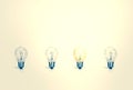 Outstanding creative idea background concept . one Light bulb glowing among a group light bulbs.vintage color tone Royalty Free Stock Photo