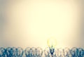 Outstanding creative idea background concept . one Light bulb glowing among a group light bulbs.vintage color tone Royalty Free Stock Photo