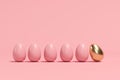 Outstanding golden egg among brown eggs on pink background