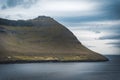 Outstanding panorama of Faroese Island cliffs and ocean mirror. Eysturoy, Faroe Islands, Denmark.