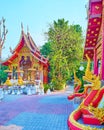 The red Naga serpents and Ubosot building of Wat Mai Tang Wat Methang, Chiang Mai, Thailand