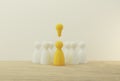 Outstanding yellow people standing with light bulb icon out from the crowd. Human resource, Talent management, Recruitment