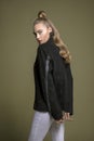 Outstanding young model posing in stylish black jean coat