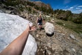 Giving another hiker a helping hand through the snow in Eastern Sierra backcountry Royalty Free Stock Photo