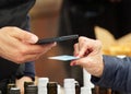 Electronic payment for goods at the outdoor market, close-up